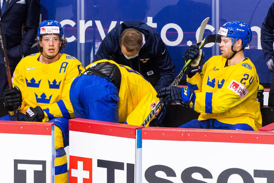 Mario Kempe of Sweden in pain as he leaves the ice