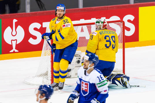 Magnus Nygren and goalkeeper Adam Reideborn of Sweden looks