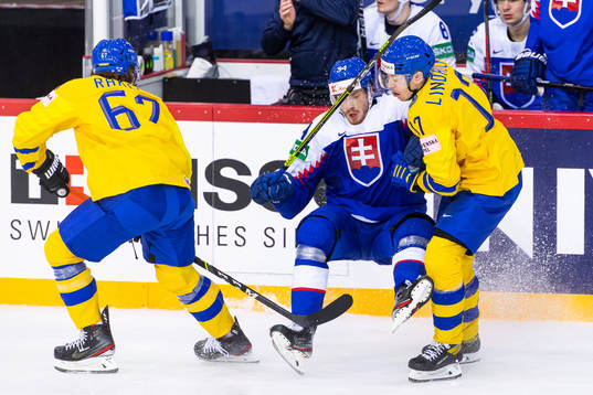 Rickard Rakell and Pär Lindholm of Sweden against Peter