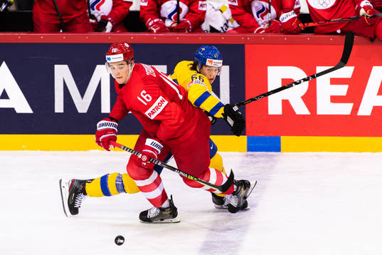 Nikita Zadorov of Russia and Rickard Rakell of Sweden