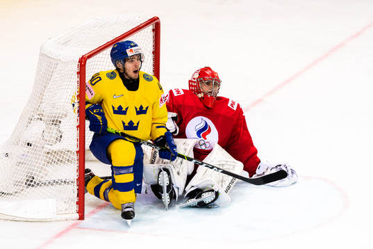 Andreas Wingerli of Sweden and goalkeeper Alexander Samonov