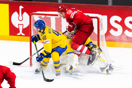 Anton Slepyshev of Russia collides with goalkeeper Adam