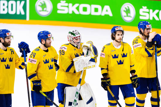 Oscar Lindberg and goalkeeper Adam Reideborn of Sweden