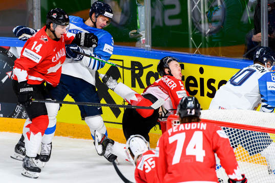 Olli Maatta of Finland against Adam Henrique and Jacob