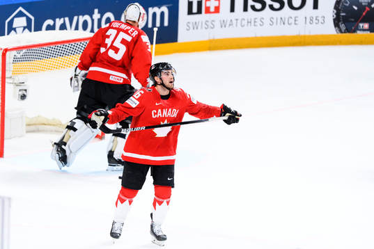 Goalkeeper Darcy Kuemper  and Sean Walker of Canada look