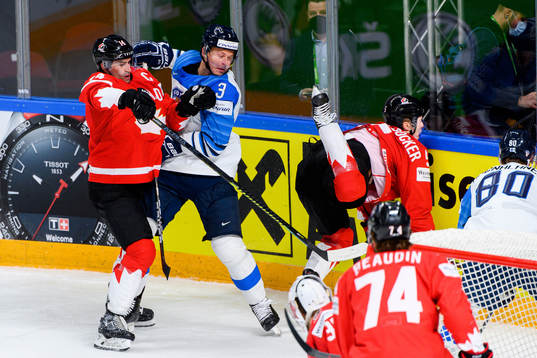 Olli Maatta of Finland against Adam Henrique and Jacob