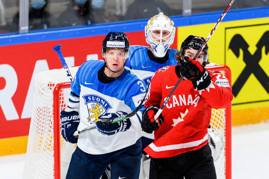 Olli Maatta and goalkeeper Jussi Olkinuora of Finland