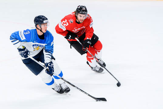 Olli Maatta of Finland and Brandon Hagel of Canada