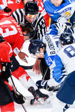 Face-off between Gabriel Vilardi of Canada and Hannes