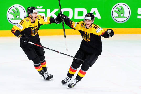 Moritz Muller and Leonhard Pfoderl of Germany celebrate the