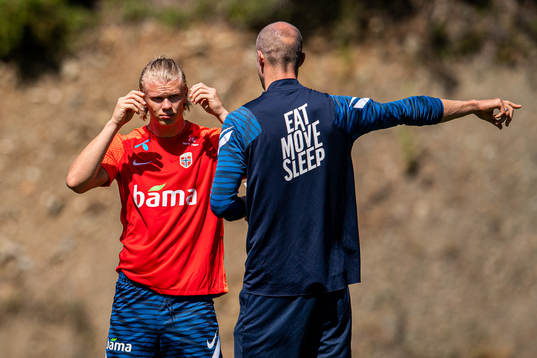 Erling Braut Haaland listens to Brede Hangeland, player