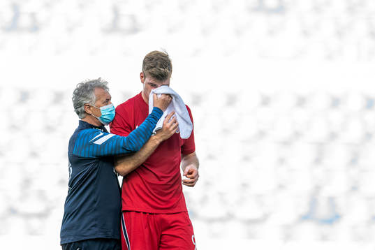 Alexander Sørloth of Norway receives medial treatment from