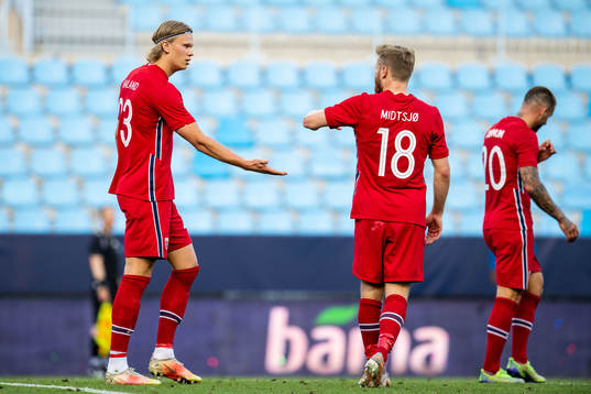 Erling Braut Haaland of Norway celebrates with teammate