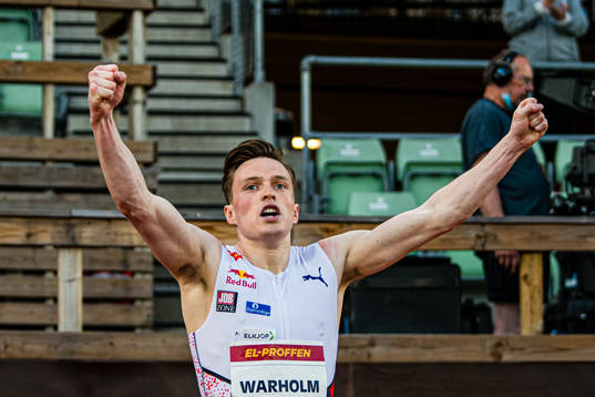 Karstein Warholm of Dimna IL celebrates