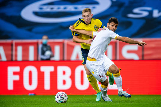 Dejan Kulusevski of Sweden and Taron Voskanyan of Armenia
