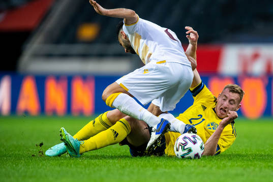 Andre Jack Calisir of Armenia and Dejan Kulusevski of Sweden