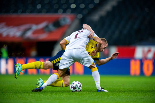 Andre Jack Calisir of Armenia and Dejan Kulusevski of Sweden