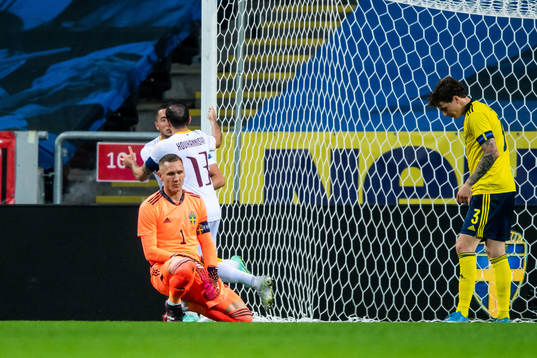 Goalkeeper Robin Olsen of Sweden looks dejected and Vahan