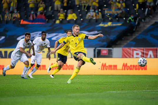 Sebastian Larsson of Sweden shoots a penalty shot