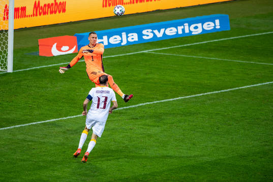Goalkeeper Robin Olsen of Sweden and Kamo Hovhannisyan of