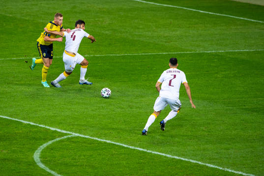 Dejan Kulusevski of Sweden and Taron Voskanyan of Armenia