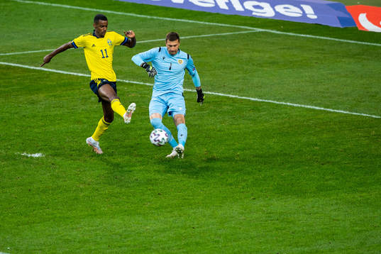 Alexander Isak of Sweden and goalkeeper Davit Yurchenko of