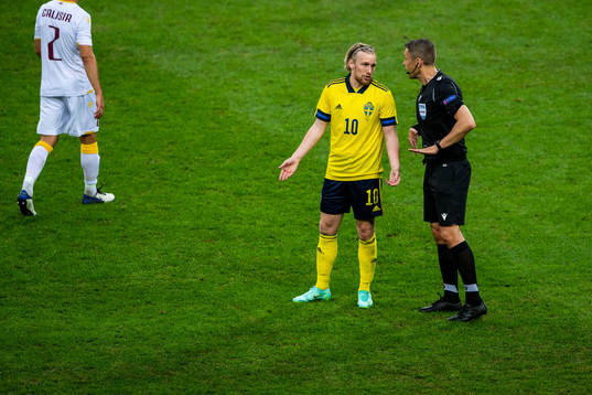 Emil Forsberg of Sweden and referee Mattias Gestranius