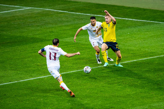 Andre Jack Calisir of Armenia and Dejan Kulusevski of Sweden