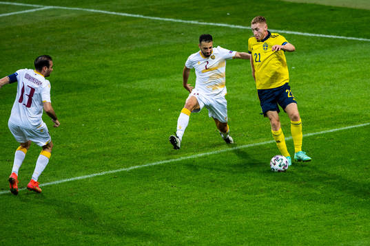 Andre Jack Calisir of Armenia and Dejan Kulusevski of Sweden