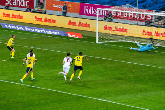 Goalkeeper Davit Yurchenko of Armenia saves a penalty from