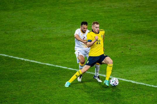Andre Jack Calisir of Armenia and Dejan Kulusevski of Sweden