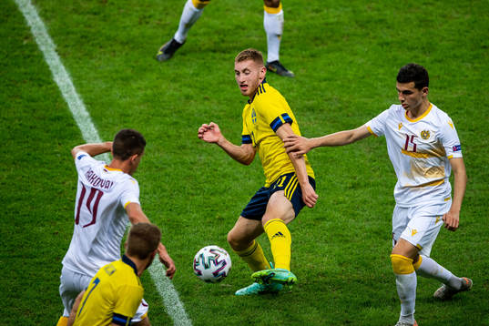 Dejan Kulusevski of Sweden and Eduard Spertsyan of Armenia