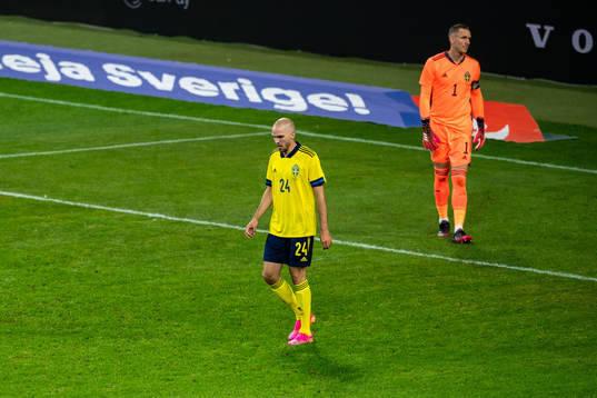 Marcus Danielson and goalkeeper Robin Olsen of Sweden looks