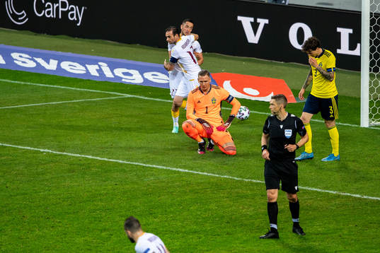 Goalkeeper Robin Olsen of Sweden looks dejected and Vahan