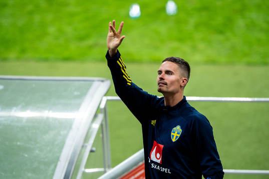 Mikael Lustig of Sweden waves