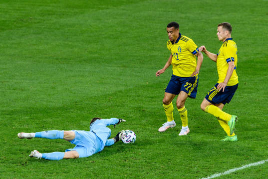 goalkeeper Davit Yurchenko of Armenia against Robin Quaison