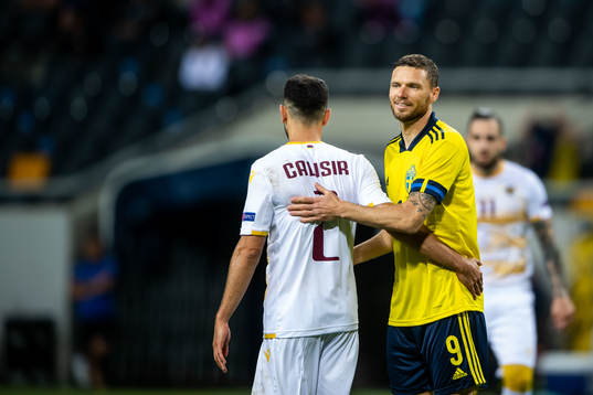 Andre Jack Calisir of Armenia and Marcus Berg of Sweden