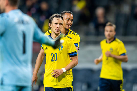 Kristoffer Olsson and Robin Quaison of Sweden celebrates