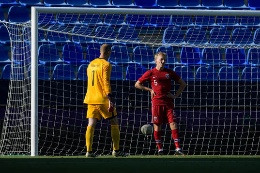 goalkeeper André Hansen and Birger Meling of Norway look