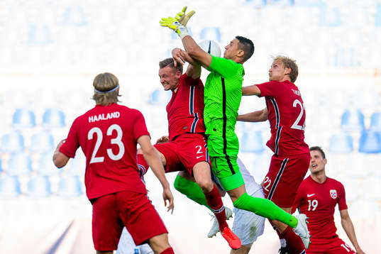 Stian Gregersen of Norway and goalkeeper Odisseas