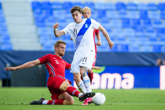 Kristoffer Ajer of Norway and Konstantinos Tsimikas of