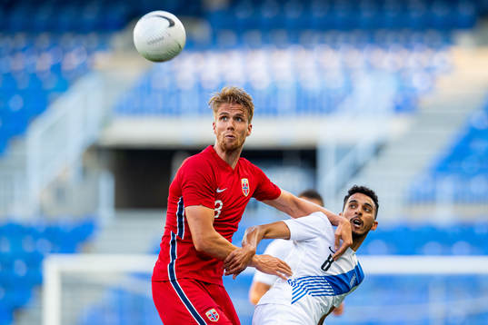 Kristoffer Ajer of Norway and Carlos Zeca of Greece