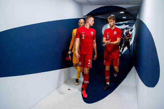 Stian Gregersen and Kristoffer Ajer of Norway at half-time