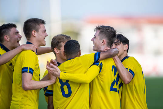 Patrik Wålemark of Sweden celebrates 5-0 with teammates