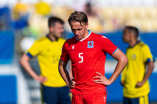 Mathias Olesen of Luxembourg looks dejected