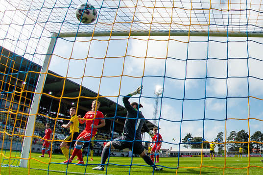 Emil Holm of Sweden scores 1-0 behind goalkeeper Tim Kips