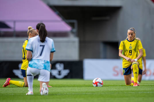 Kosovare Asllani of Sweden takes a knee