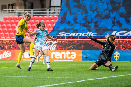 Stina Blackstenius of Sweden and Tuva Hansen and goalkeeper