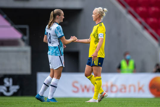 Frida Maanum of Norway and Caroline Seger of Sweden