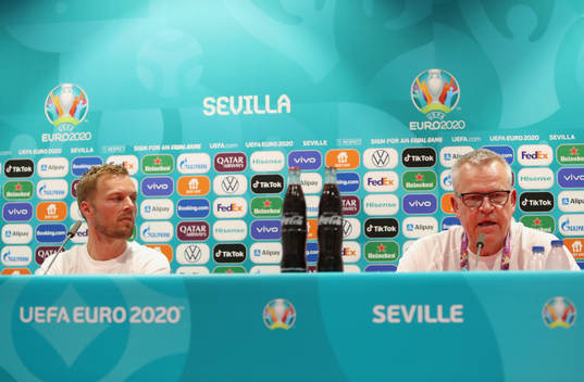 In this handout photo from UEFA Sebastian Larsson and head